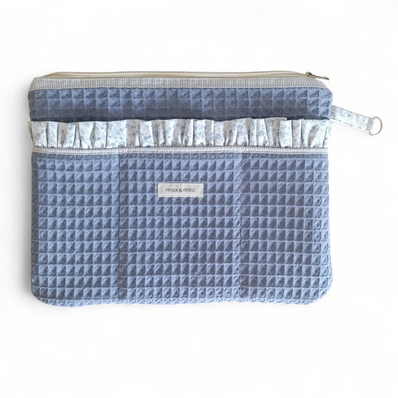 front-view-of-a-blue-waffle-weave-laptop-sleeve-with-a-decorative-ruffled-edged-front-pocket-with-the-brand-name-max-&-milo-stitched-onto-the-front-of-the-sleeve